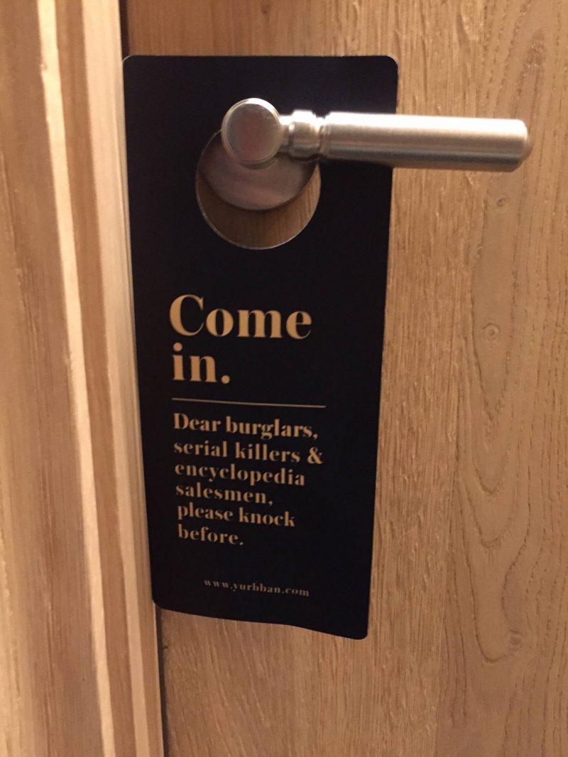 Funny door sign at a hotel in Barcelona