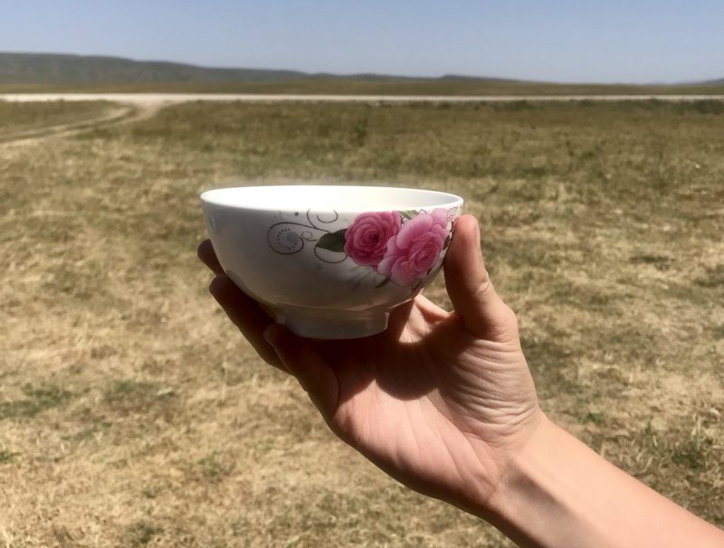 Holding a porcelain cup