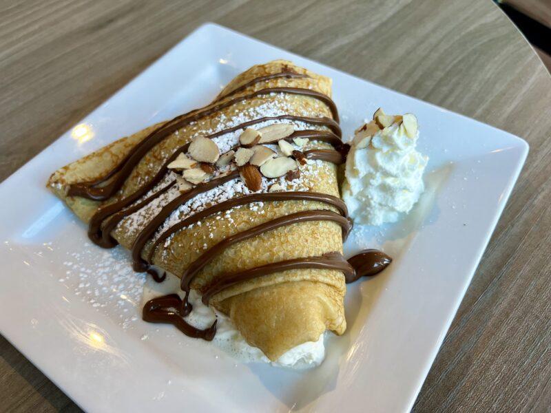 Crepe with chocolate sauce and whipped cream
