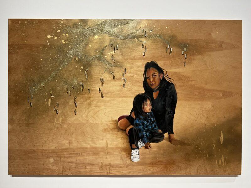 Painting of Indigenous woman and her daughter on gold background