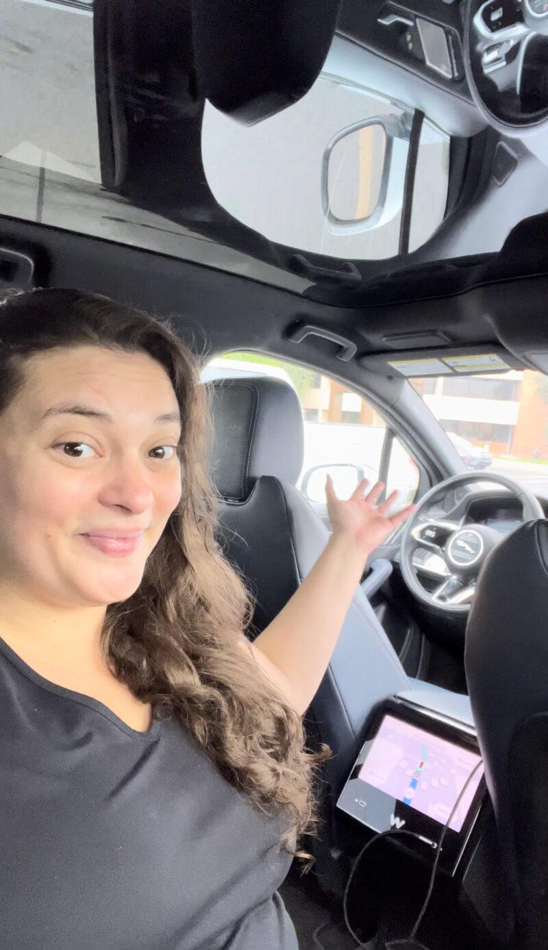 Woman riding in self-driven car