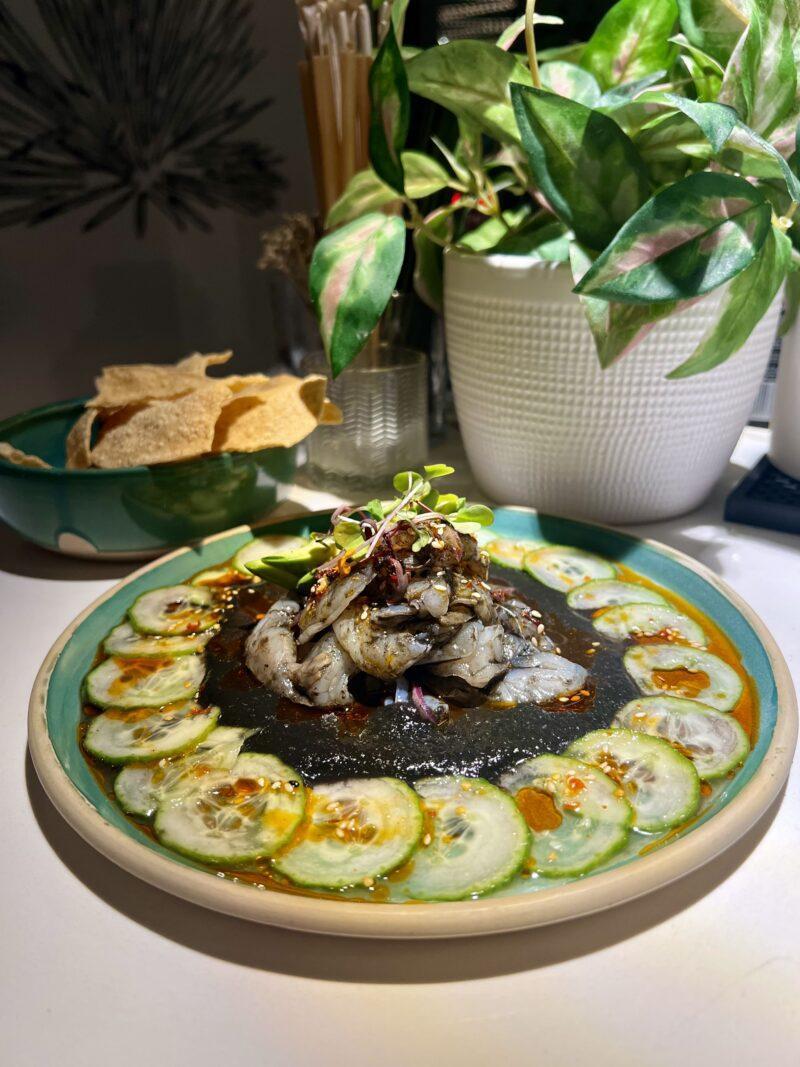 Aguachile arranged within circle of cucumber slices