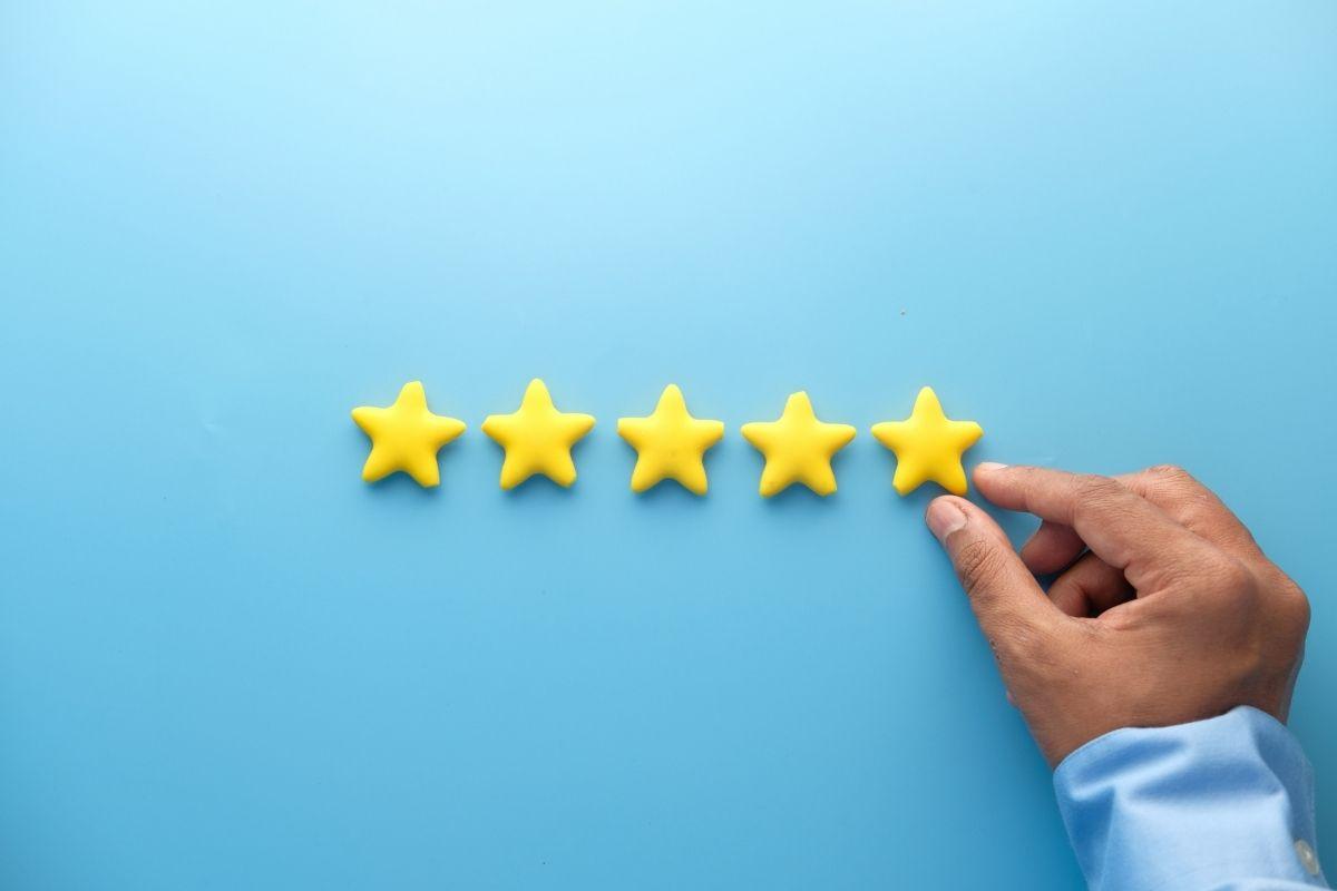 5 gold stars on a blue board