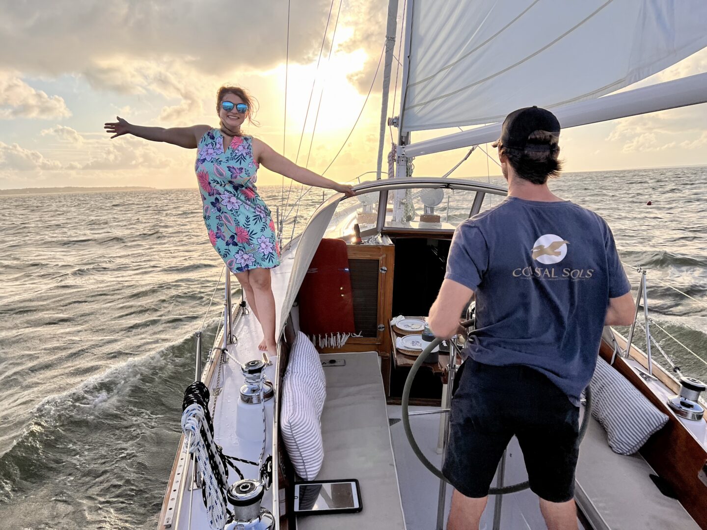 Stretching out under the sun on a sailboat