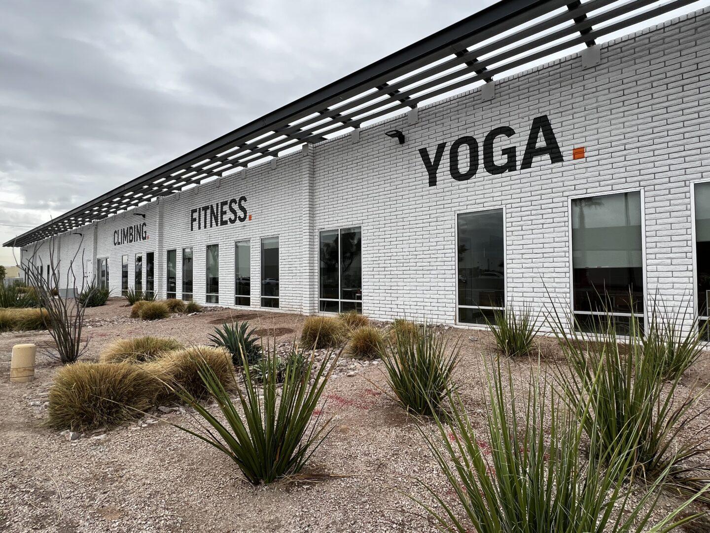 White building exterior with desert landscaping