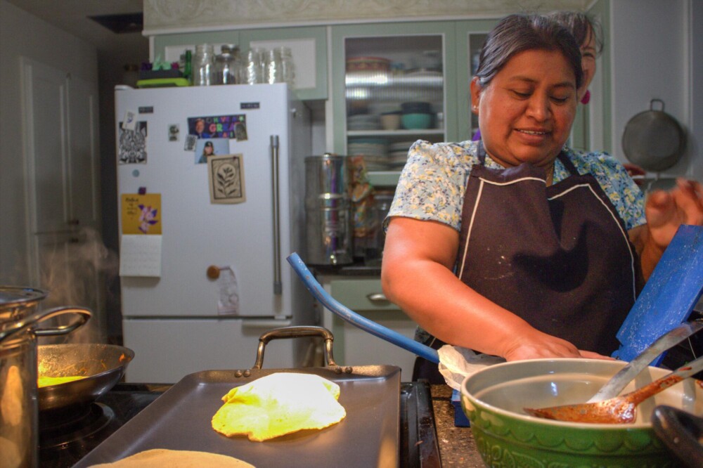 Woman making tortillas from scratch