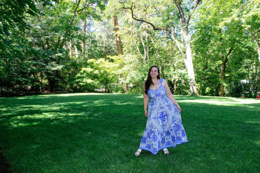 Woman in blue dress in park