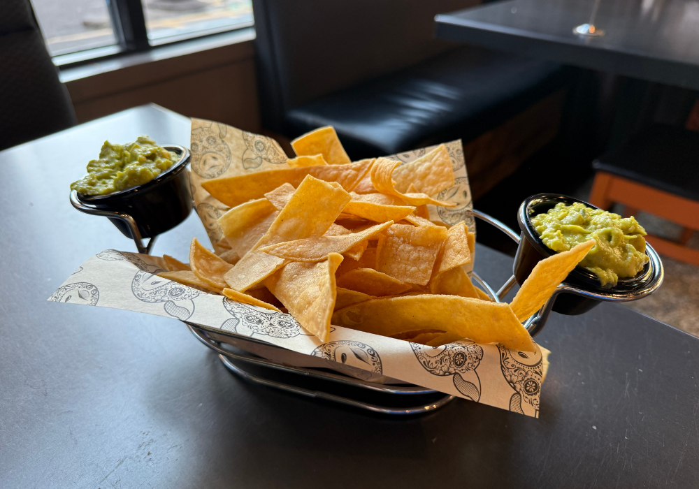 chips with two guacamole dips on the side